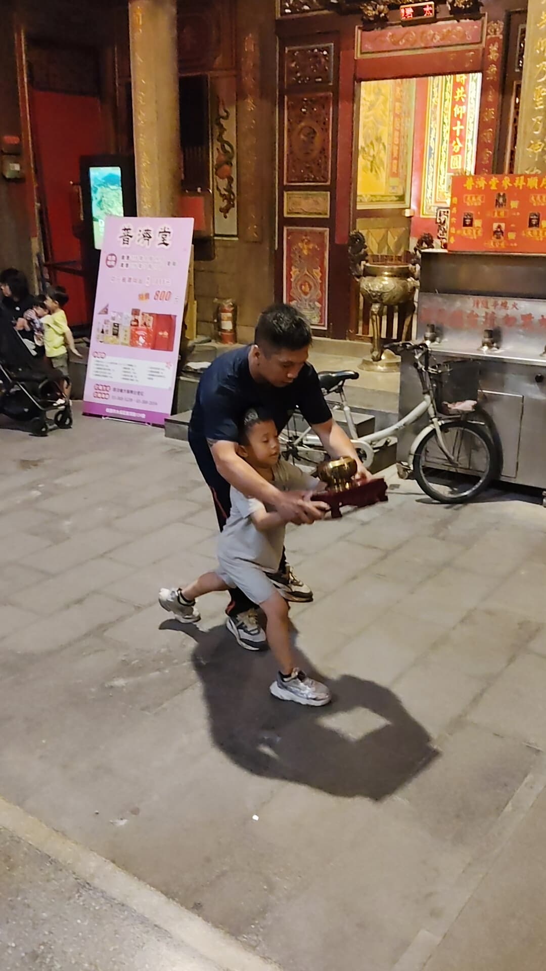 The Gong Yi Tuan troupe rehearsing at night ahead of the 624th festival in front of Puji Temple